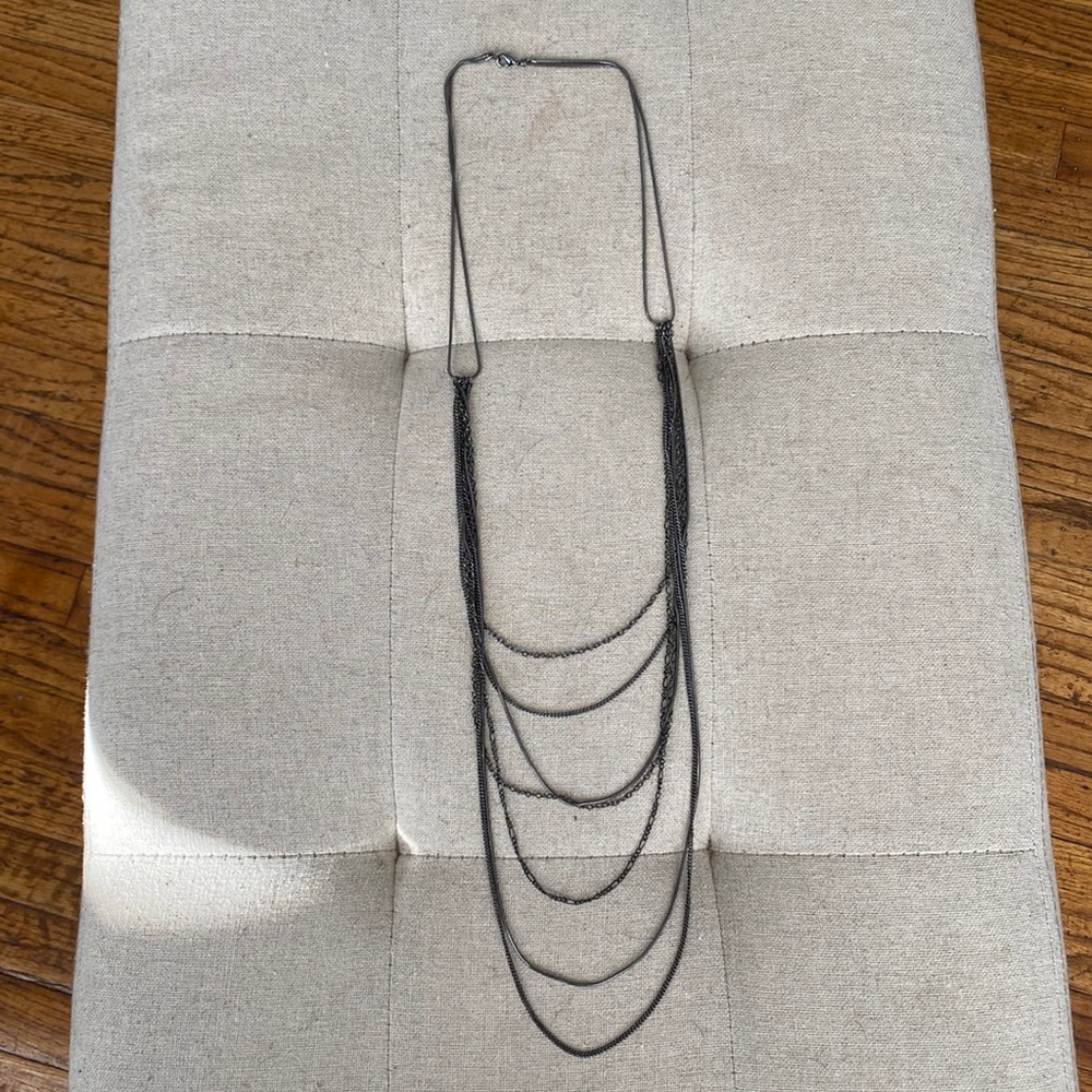 Dark gray metal multi strand necklace.